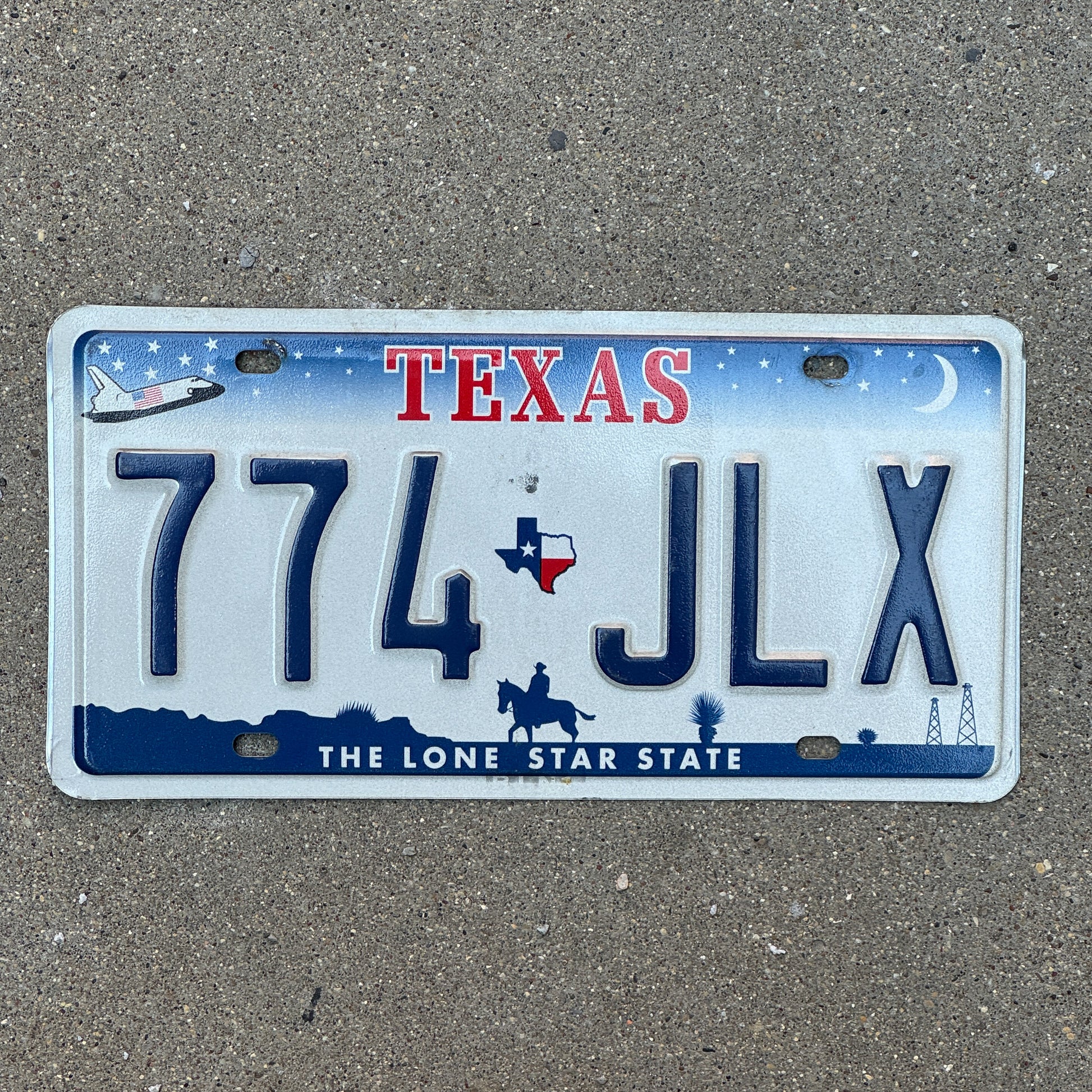 Photo of a 2000 Texas License Plate Auto Tag 2 Vintage Garage Space Shuttle Base 774 JLX with original patina
