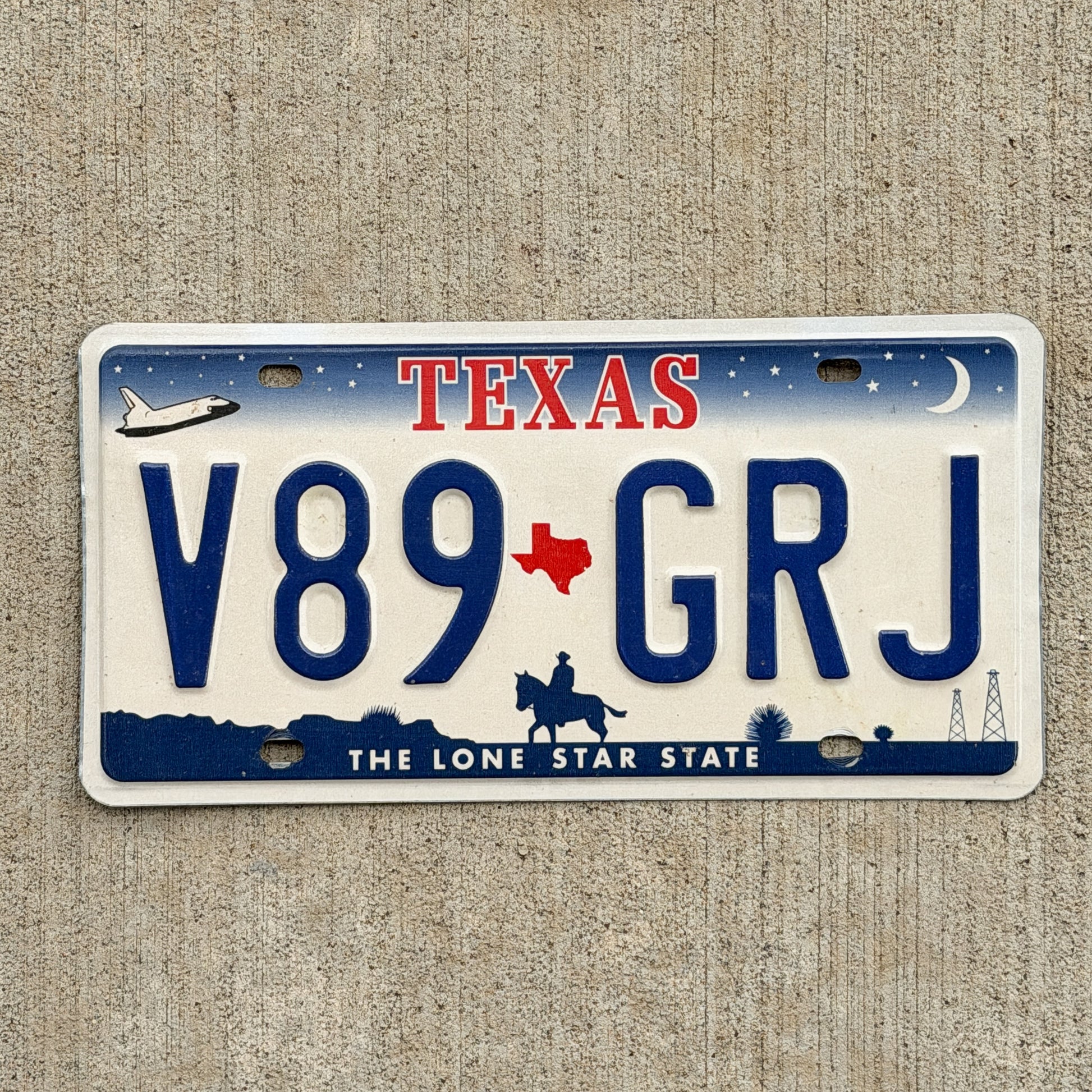 Photo of a 2000 Texas License Plate Auto Tag 2 Vintage Garage V89 GRJ with original patina