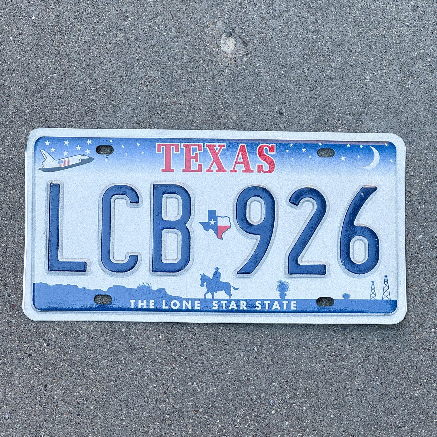 Photo of a 2000 Texas License Plate Auto Tag Garage Decor Vintage Space Shuttle Base LCB 926 with original patina