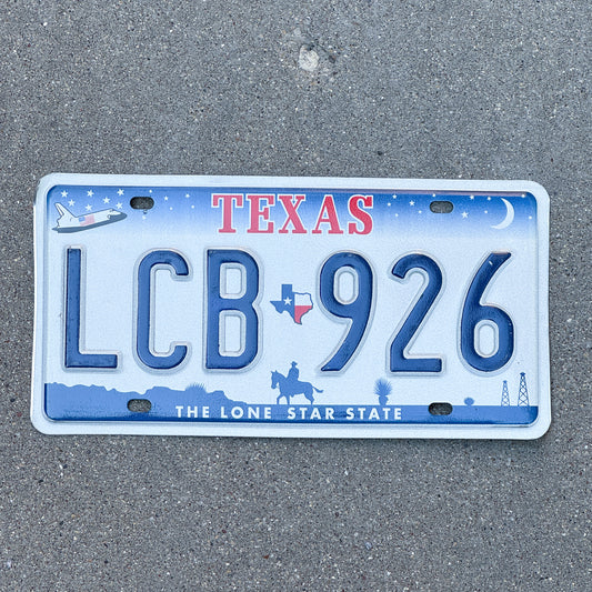 Photo of a 2000 Texas License Plate Auto Tag Garage Decor Vintage Space Shuttle Base LCB 926 with original patina