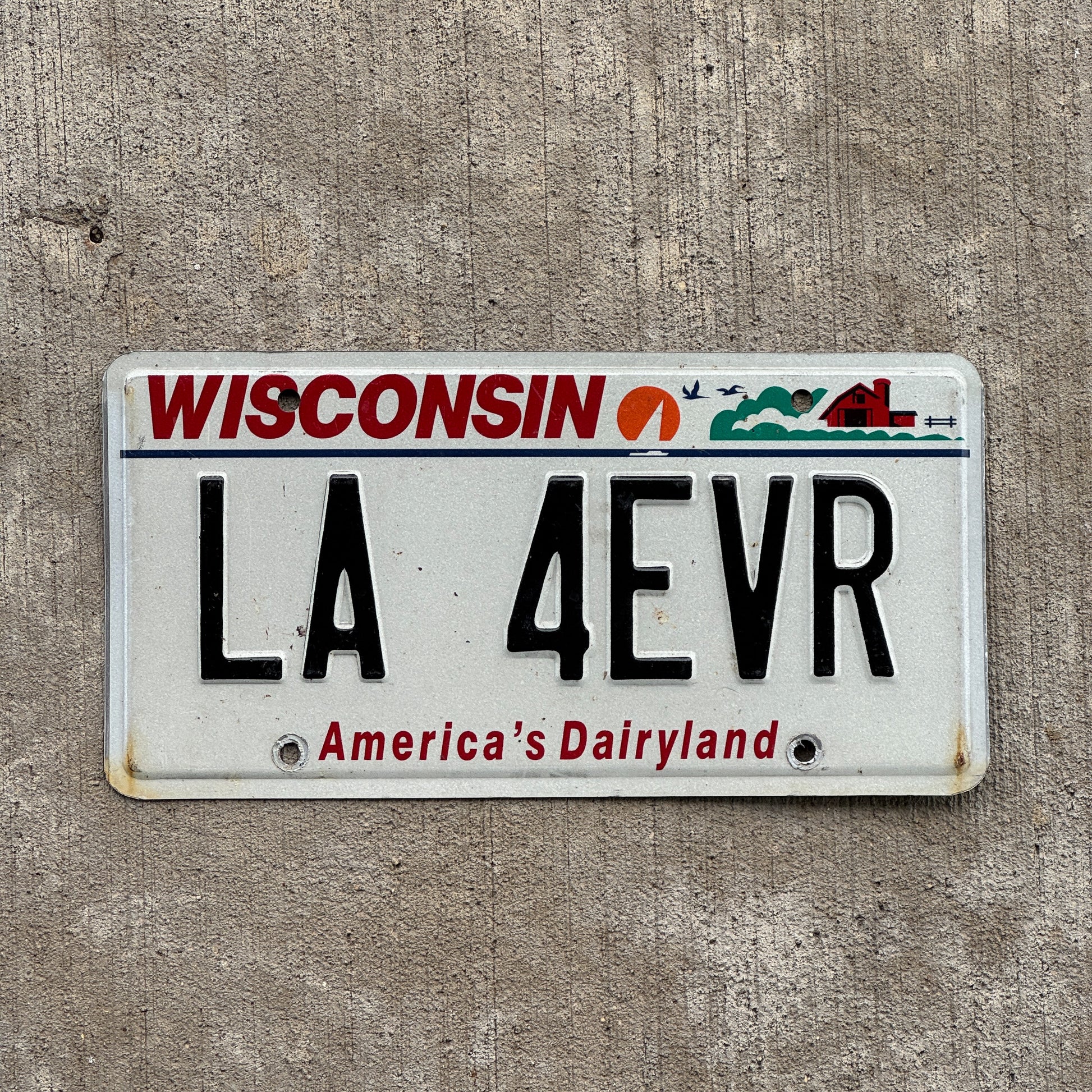 Photo of a 2000 Wisconsin Vanity License Plate Auto Tag Garage Decor Vintage Los Angeles Forever LA 4 EVR with original patina
