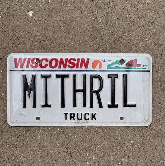 Photo of a 2000 Wisconsin Vanity Truck License Plate Auto Tag Garage Decor Vintage Fantasy Armor Metal MITHRIL with original patina