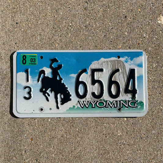 Photo of a 2001 2003 Wyoming License Plate Auto Tag Garage Decor Vintage Cowboy Rodeo 13 6564 with original patina
