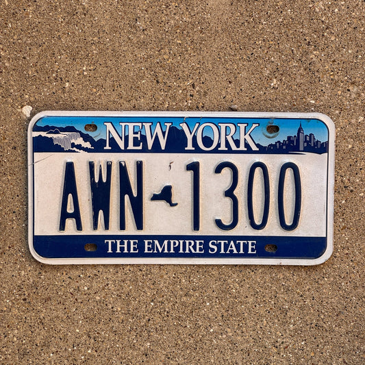 Photo of a 2001 New York License Plate Auto Tag Garage Decor Vintage AWN 1300
