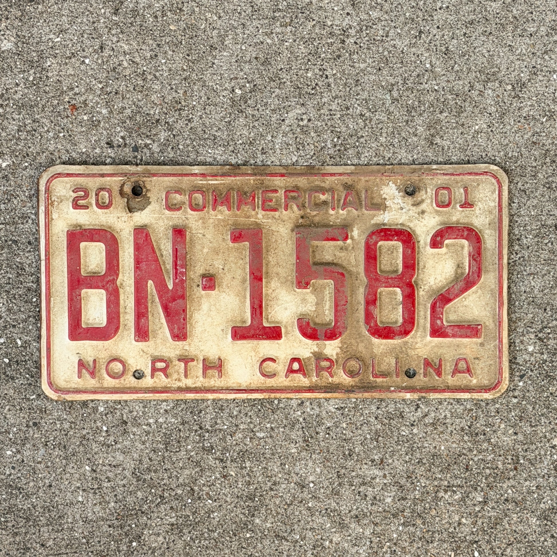 Photo of a 2001 North Carolina Commercial License Plate Auto Tag Garage Decor Vintage BN 1582 with original patina
