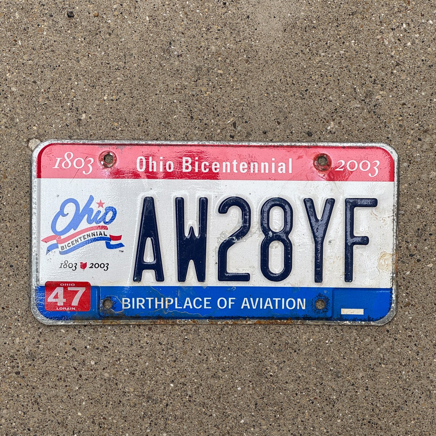 Photo of a 2002 2003 Ohio License Plate Auto Tag 1 Vintage Garage AW 28 YF with original patina