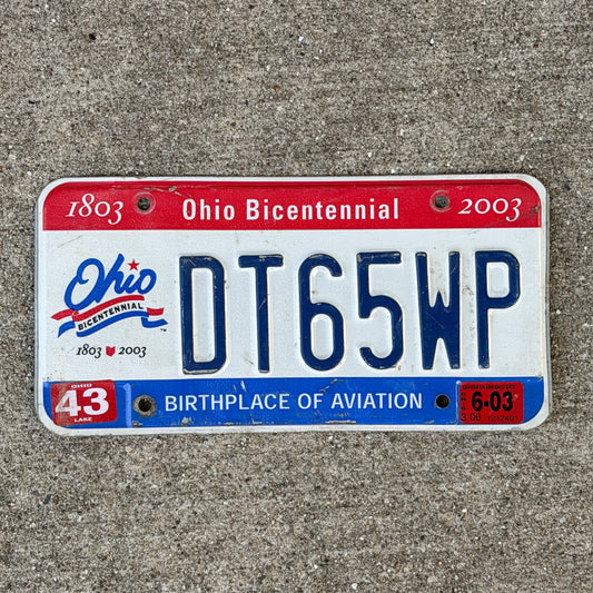 Photo of a 2002 2003 Ohio License Plate Auto Tag Garage Decor Vintage DT 65 WP with original patina