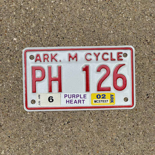 Photo of a 2002 Arkansas Purple Heart Motorcycle License Plate Auto Tag Garage Decor Vintage Military Natural 2002 Sticker PH 126