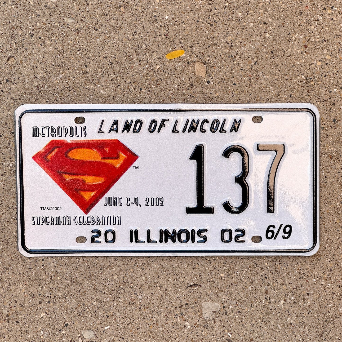 Photo of a 2002 Illinois Event License Plate Auto Tag 1 Garage Decor Metropolis Illinois Superman Comics 137 with original patina