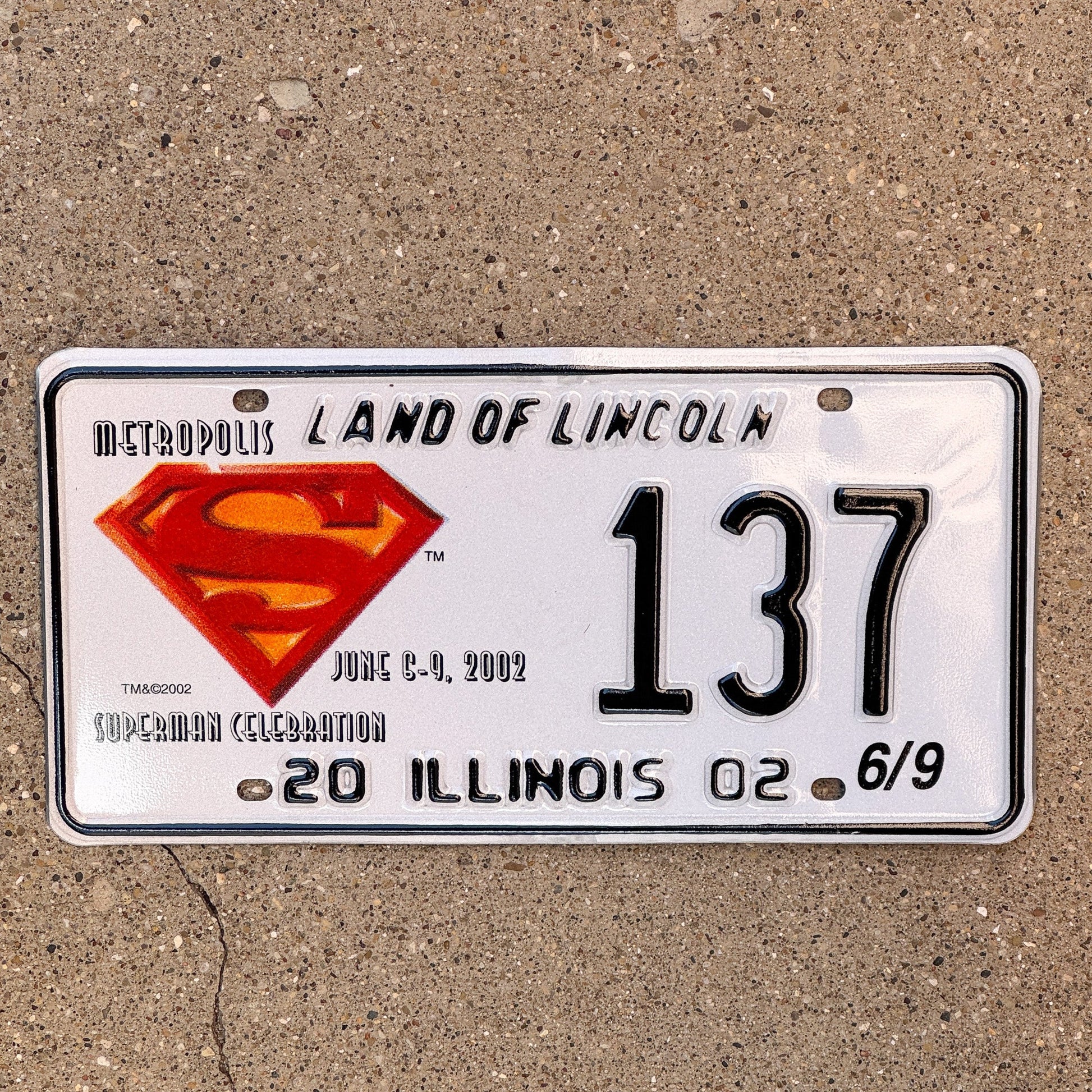 Photo of a 2002 Illinois Event License Plate Auto Tag 2 Garage Decor Metropolis Illinois Superman Comics 137 with original patina