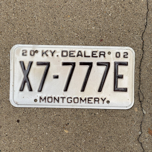 Photo of a 2002 Kentucky Dealer License Plate Auto Tag Garage Decor Vintage Repeat Repeating X 7777 E