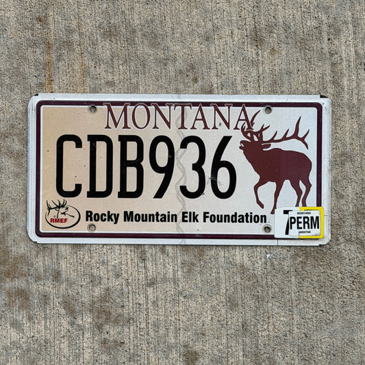 Photo of a 2002 Montana Graphic / Specialty License Plate Auto Tag Garage Decor Vintage Rocky Mountain Elk Foundation Wildlife CDB 936 with original patina
