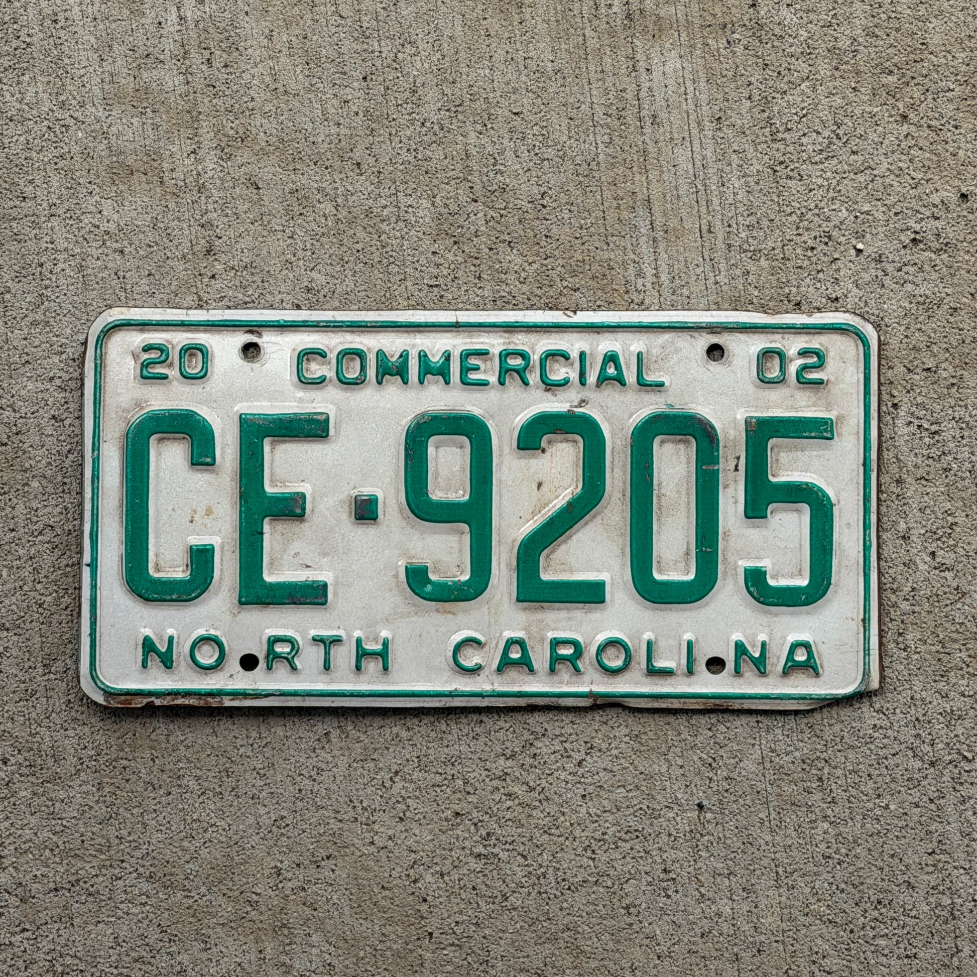 Photo of a 2002 North Carolina Commercial License Plate Auto Tag Garage Decor Vintage CE 9205 with original patina