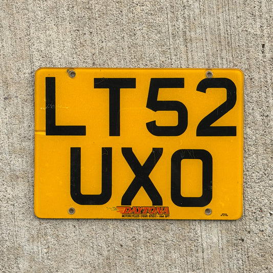 Photo of a 2002 United Kingdom Motorcycle License Plate Auto Tag Garage Decor Vintage UK England LT 52 UXO with original patina