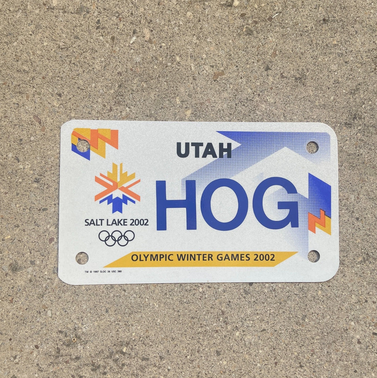 Photo of a 2002 Utah Motorcycle License Plate Auto Tag Garage Decor Vintage Graphic Olympics Harley HOG with original patina