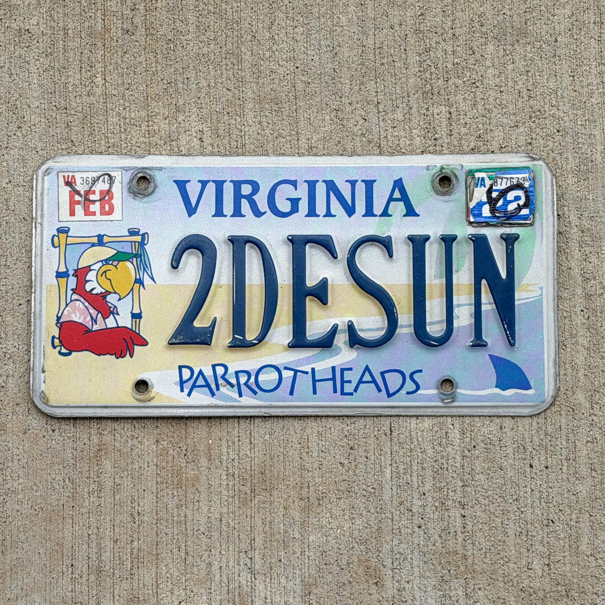 Photo of a 2003 2022 Virginia Graphic / Specialty License Plate Auto Tag Garage Decor Vintage Jimmy Buffett Parrotheads 2 DE SUN with original patina