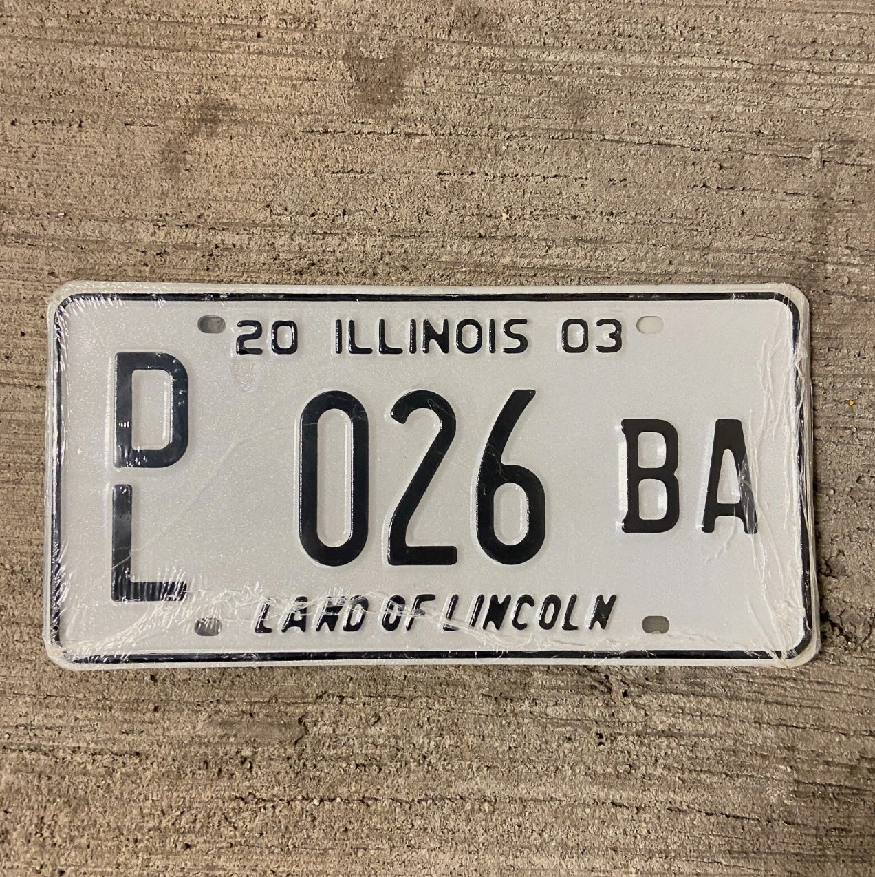 Photo of a 2003 Illinois Dealer License Plate Auto Tag Garage Decor Vintage 026 BA with original patina