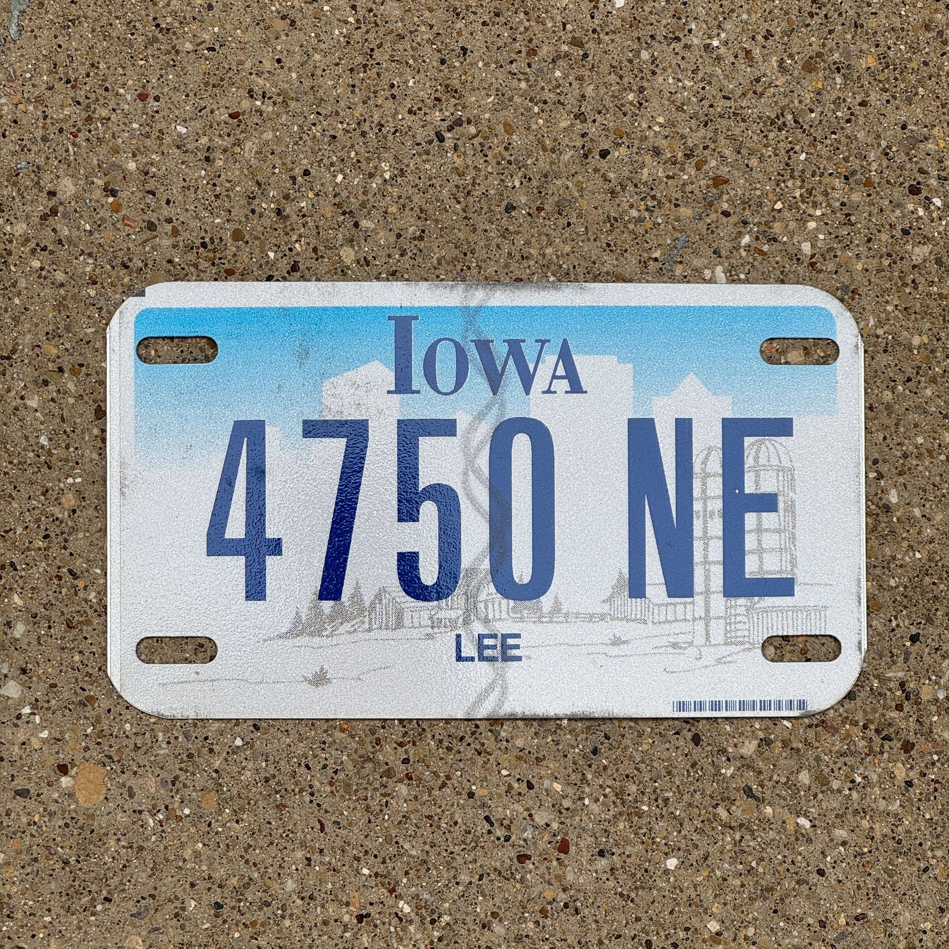 Photo of a 2003 Iowa Motorcycle License Plate Auto Tag Garage Decor Vintage Lee County 4750 NE