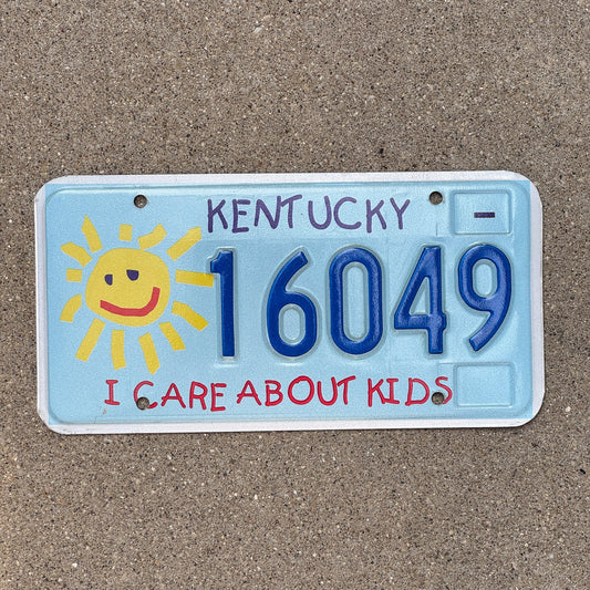 Photo of a 2003 Kentucky Graphic / Specialty License Plate Auto Tag Garage Decor Vintage I Care About Kids Children's Trust Fund 16049