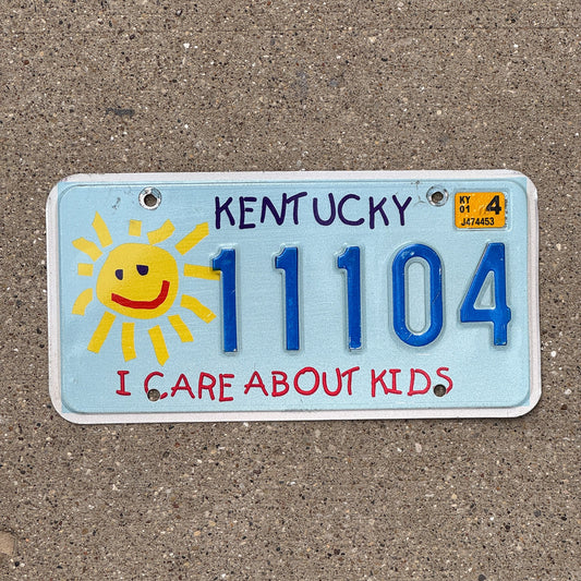 Photo of a 2003 Kentucky Graphic / Specialty License Plate Auto Tag Garage Decor Vintage I Care About Kids Childrens Trust Fund 11104
