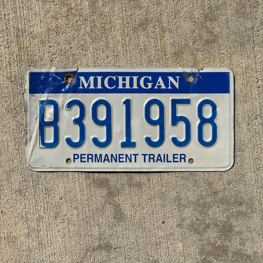 Photo of a 2003 Michigan Trailer License Plate Auto Tag Garage Decor Vintage B 391958 with original patina