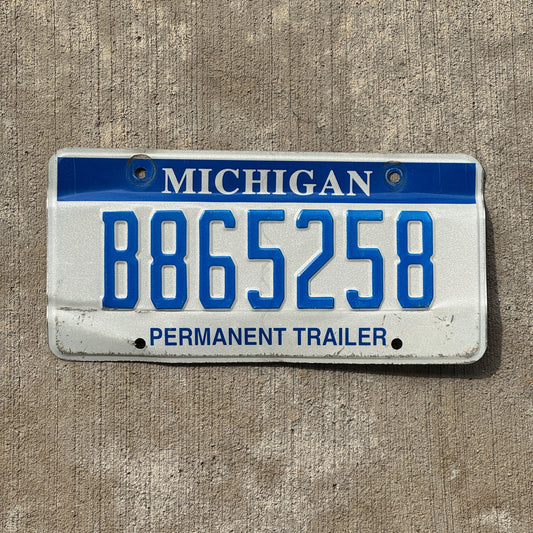 Photo of a 2003 Michigan Trailer License Plate Auto Tag Garage Decor Vintage B 865258 with original patina