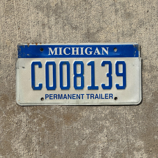Photo of a 2003 Michigan Trailer License Plate Auto Tag Garage Decor Vintage C 008139 with original patina
