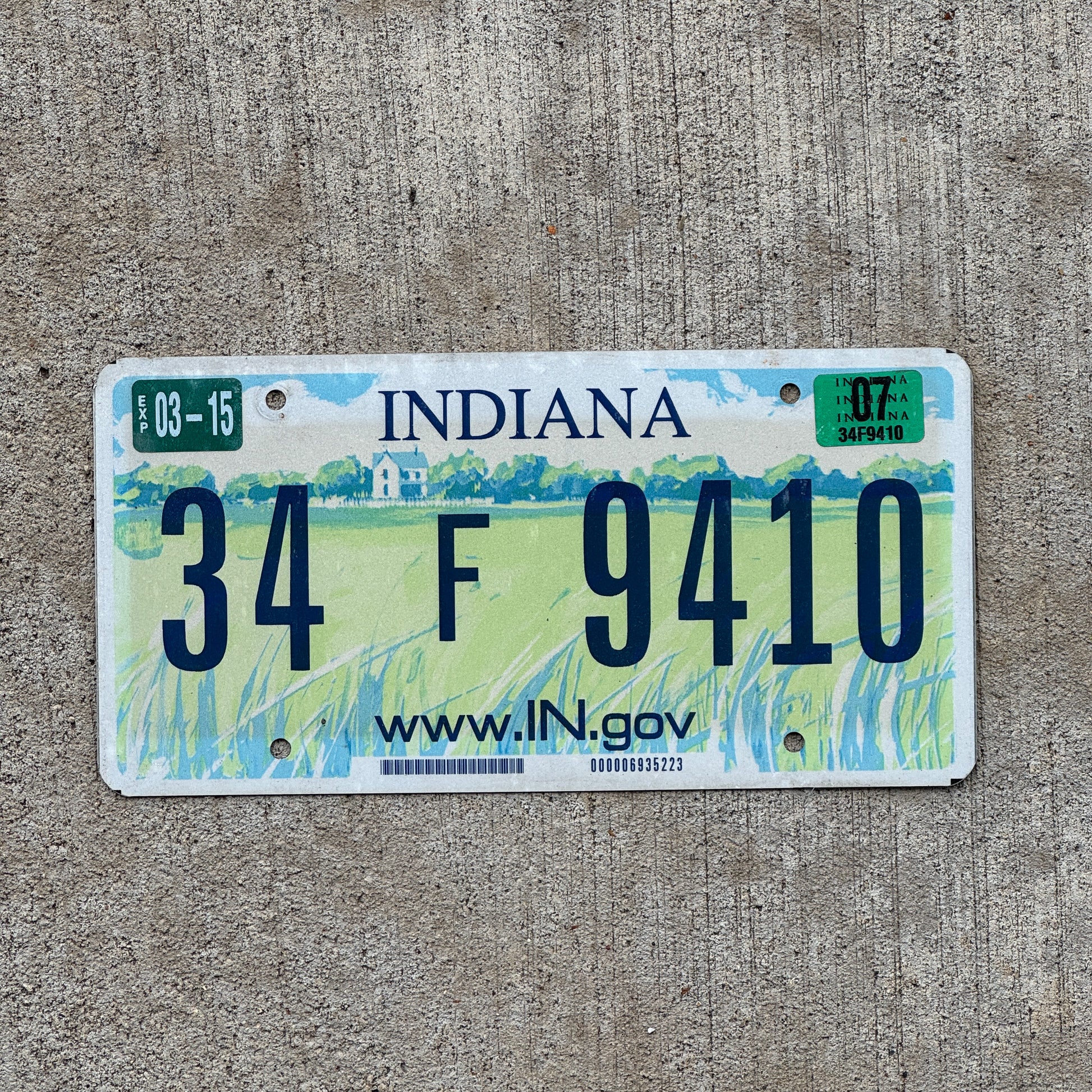 Photo of a 2004 2007 Indiana License Plate Auto Tag Garage Decor Vintage 34 F 9410 with original patina