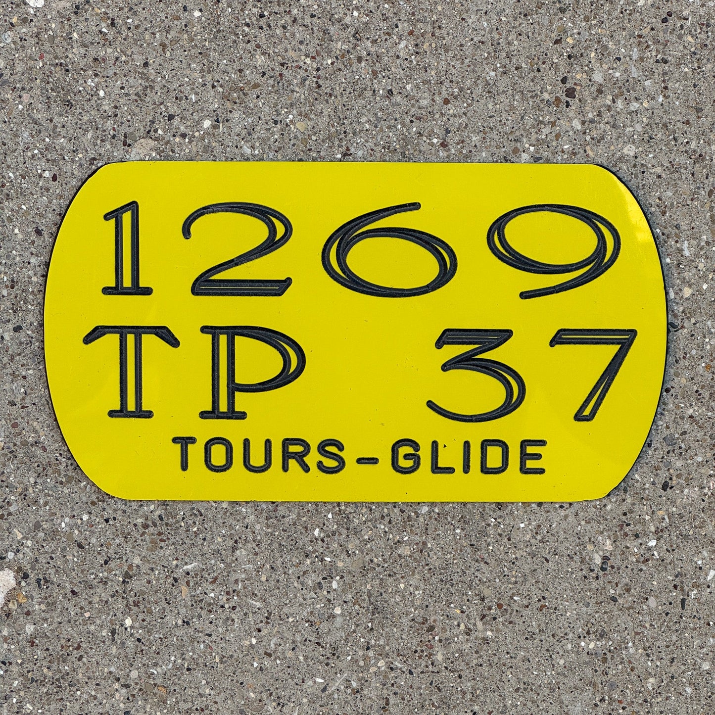 Photo of a 2004 Harley Davidson Dealer Plaque License Plate Auto Tag Garage Decor Vintage Tours Glide 1269 TP 37 with original patina