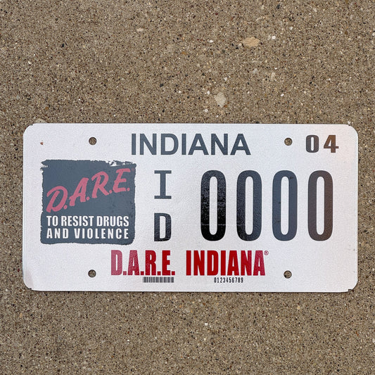 Photo of a 2004 Indiana Graphic Sample License Plate Auto Tag Garage Decor Vintage DARE ID 0000 with original patina