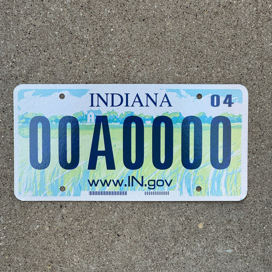 Photo of a 2004 Indiana Sample License Plate Auto Tag Garage Decor Vintage 00A0000 with original patina