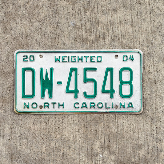 Photo of a 2004 North Carolina Commercial License Plate Auto Tag Garage Decor Vintage DW 4548 with original patina