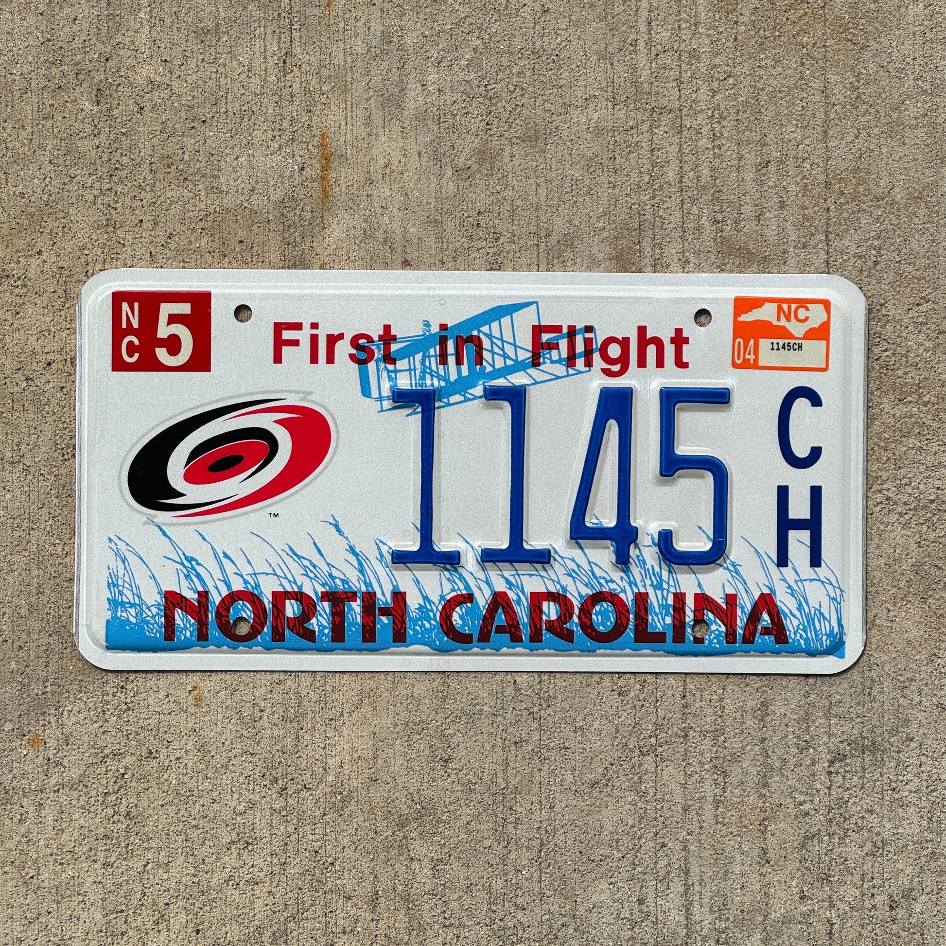 Photo of a 2004 North Carolina Graphic / Specialty License Plate Auto Tag Garage Decor Vintage Carolina Hurricanes NHL 1145