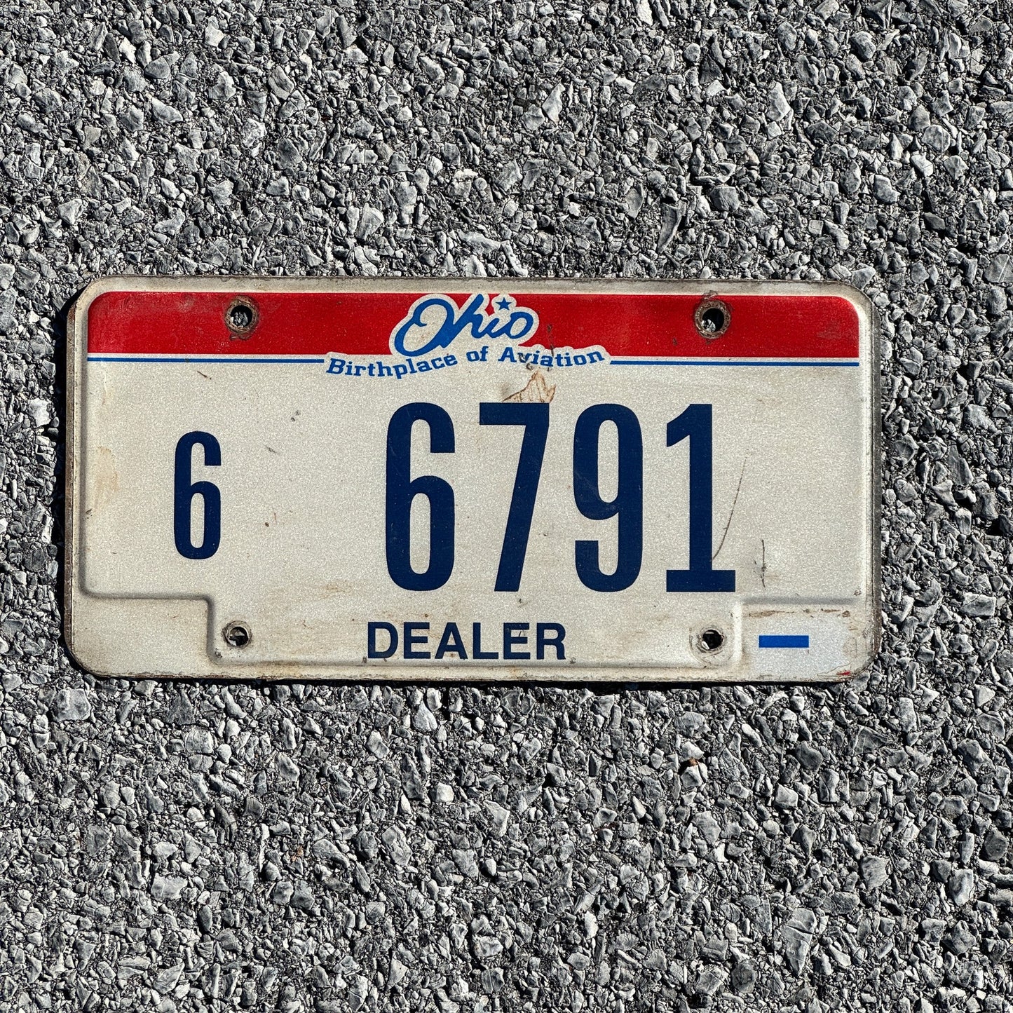 Photo of a 2004 Ohio Dealer License Plate Auto Tag Garage Decor Vintage 66791