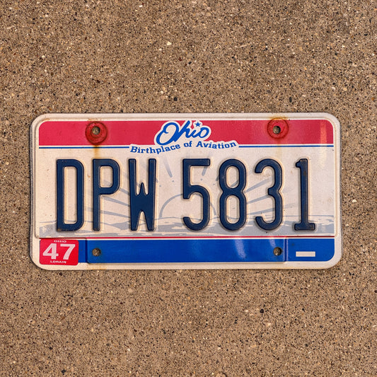 Photo of a 2004 Ohio License Plate Auto Tag 2 Vintage Garage DPW 5831 with original patina