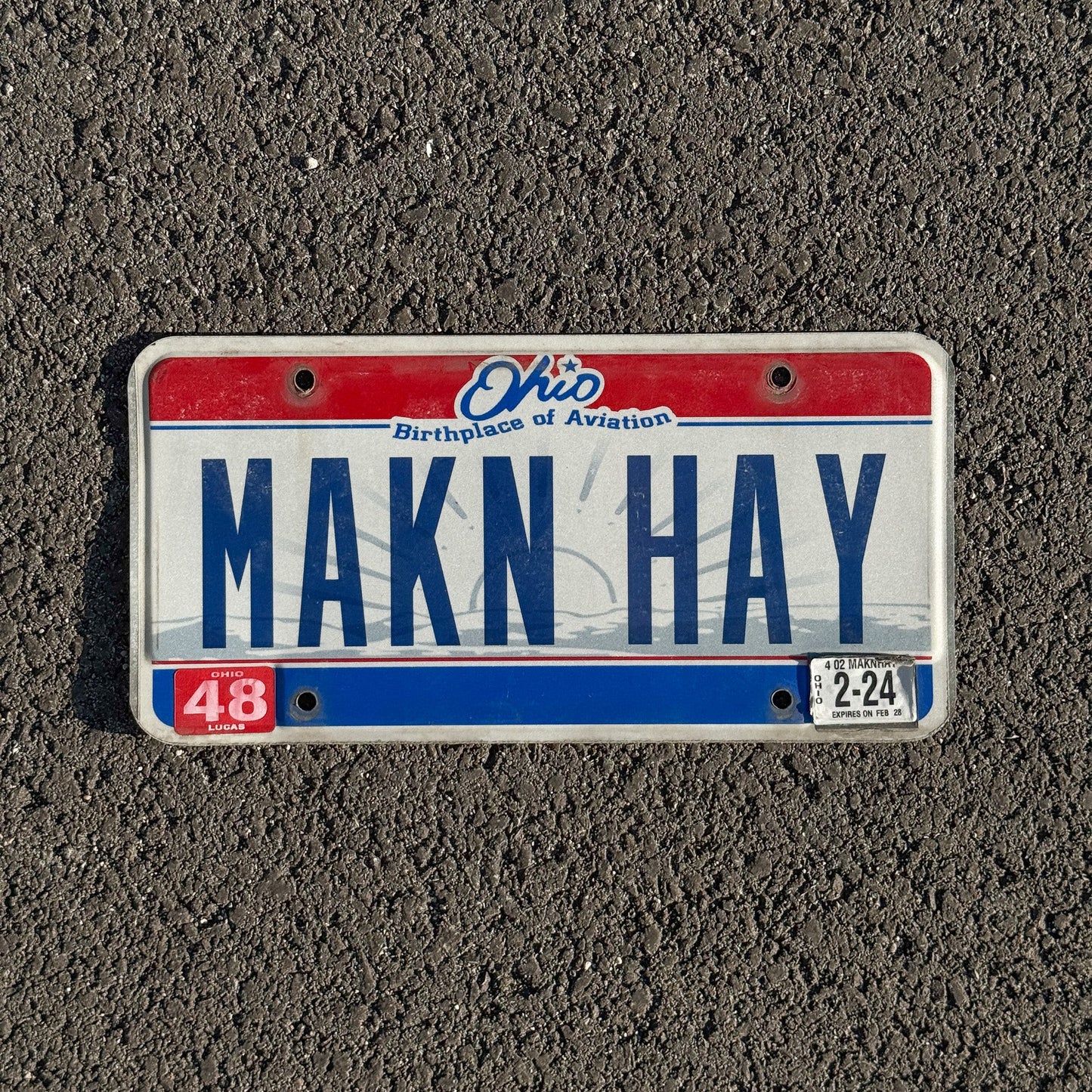 Photo of a 2004 Ohio VANITY License Plate Auto Tag Garage Decor Vintage Making Hay Slang Saying MAKN HAY