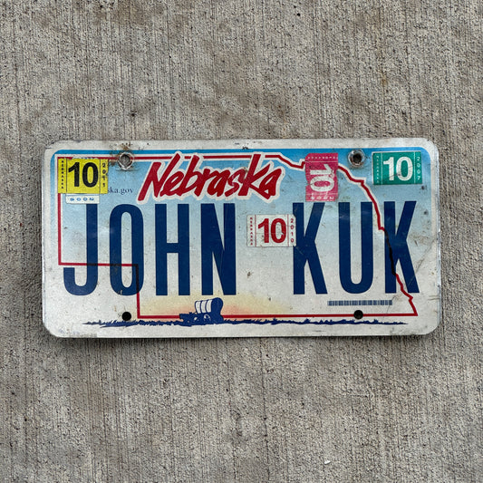 Photo of a 2005 2011 Nebraska Vanity License Plate Auto Tag Garage Decor Vintage Name JOHN KUK with original patina