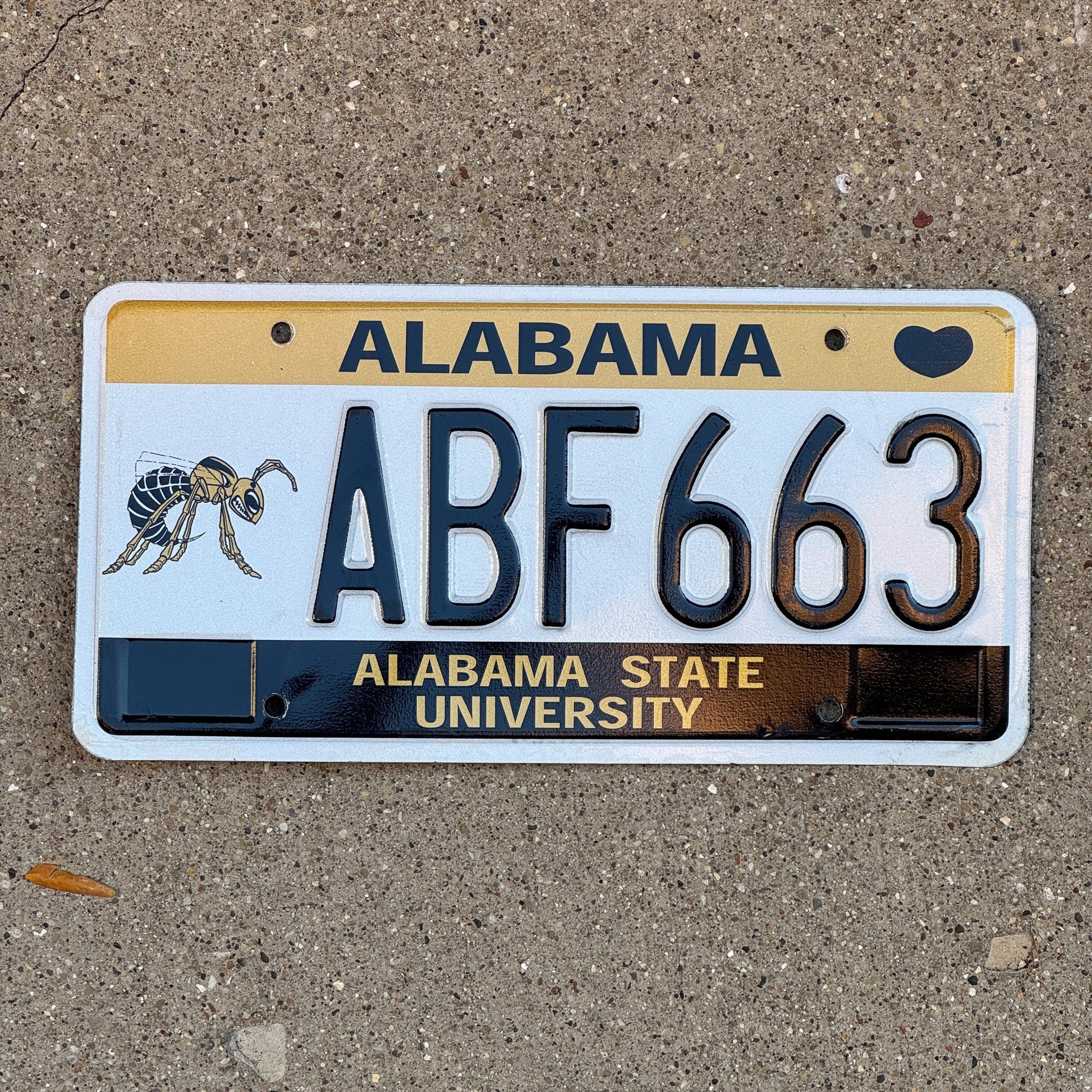 Photo of a 2005 Alabama Graphic / Specialty License Plate Auto Tag Garage Decor Vintage Alabama State University Hornets ABF 663 with original patina