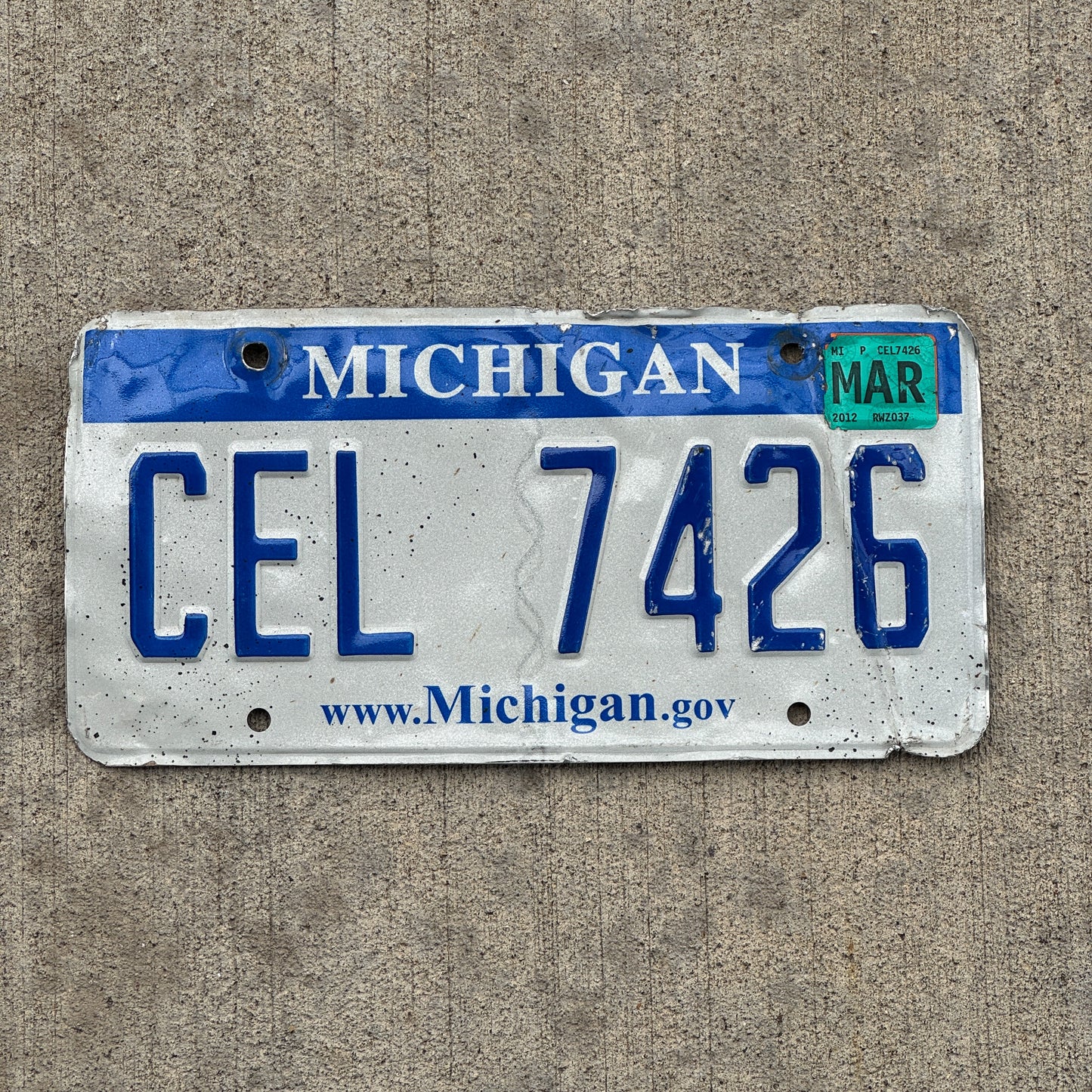 Photo of a 2006 2012 Michigan License Plate Auto Tag Garage Decor Vintage CEL 7426 with original patina