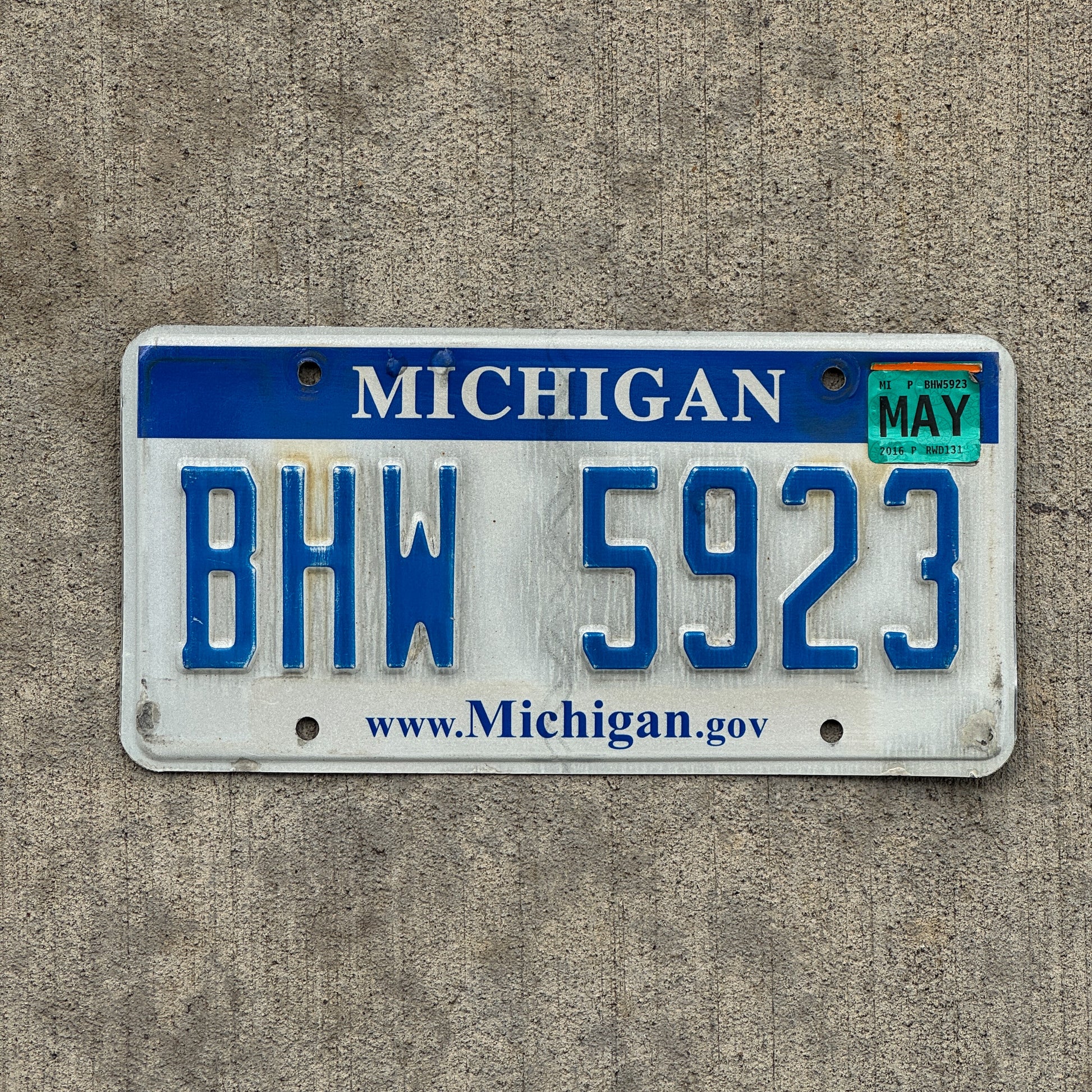 Photo of a 2006 2016 Michigan License Plate Auto Tag Garage Decor Vintage BHW 5923 with original patina