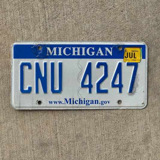 Photo of a 2006 2018 Michigan License Plate Auto Tag Garage Decor Vintage CNU 4247 with original patina