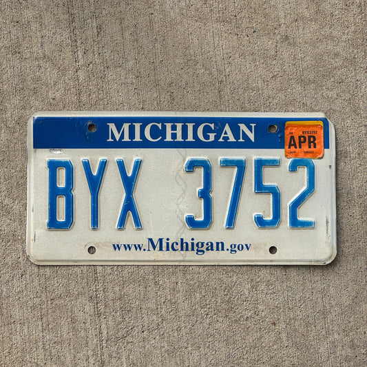 Photo of a 2006 2019 Michigan License Plate Auto Tag Garage Decor Vintage BYX 3752 with original patina