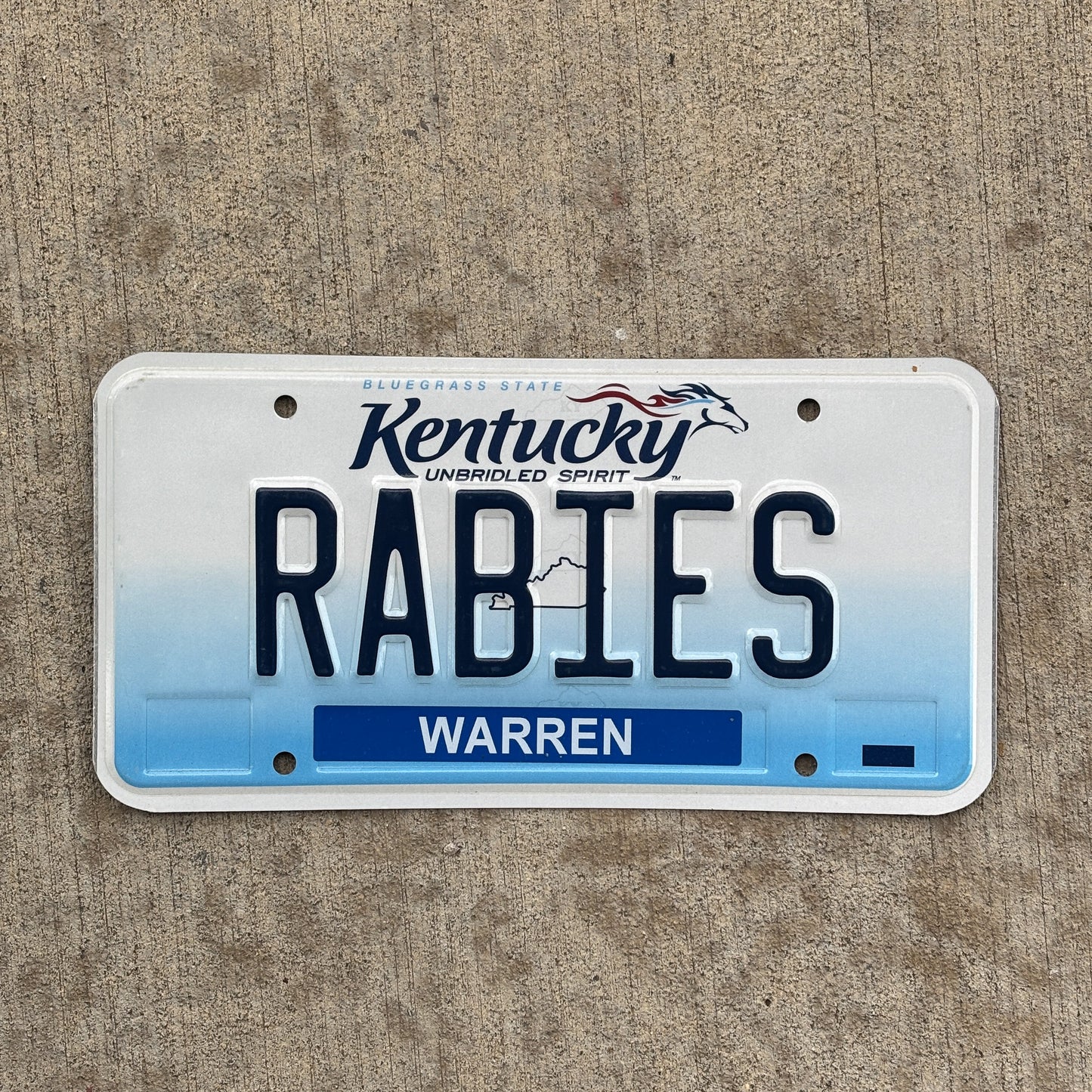 Photo of a 2006 Kentucky Vanity License Plate Auto Tag Garage Decor Vintage Doctor Disease RABIES with original patina