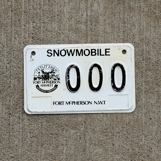 Photo of a 2006 Northwest Territories Snowmobile Sample License Plate Auto Fort McPherson Moose 000 with original patina