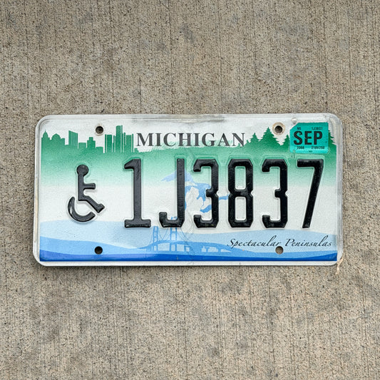 Photo of a 2007 2008 Michigan Graphic / Specialty License Plate Auto Tag Garage Decor Vintage Spectacular Peninsulas Handicap 1J3837 with original patina