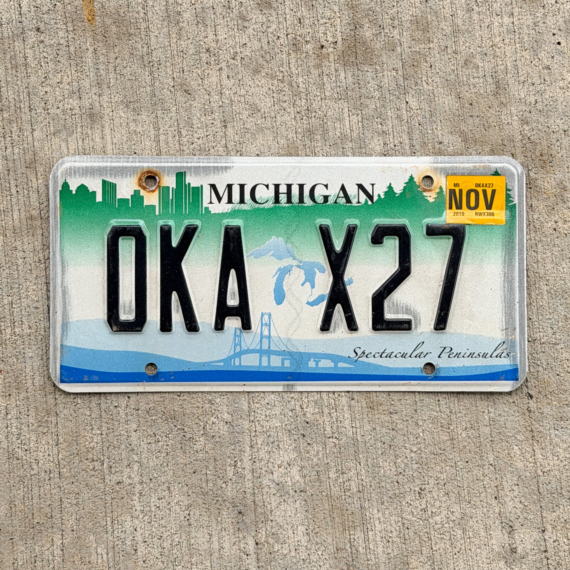 Photo of a 2007 2019 Michigan Graphic / Specialty License Plate Auto Tag Garage Decor Vintage Spectacular Peninsulas OKA X27 with original patina