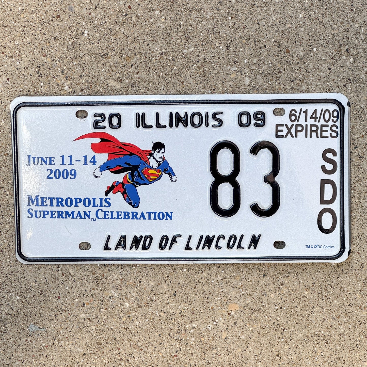 Photo of a 2009 Illinois Event License Plate Auto Tag 2 Garage Decor Metropolis Illinois Superman Comics 83 with original patina