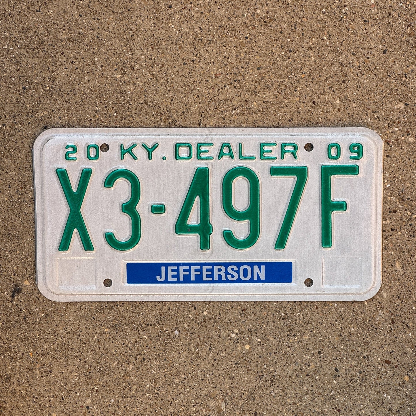 Photo of a 2009 Kentucky Dealer License Plate Auto Tag Garage Decor Vintage Jefferson County X3 497F