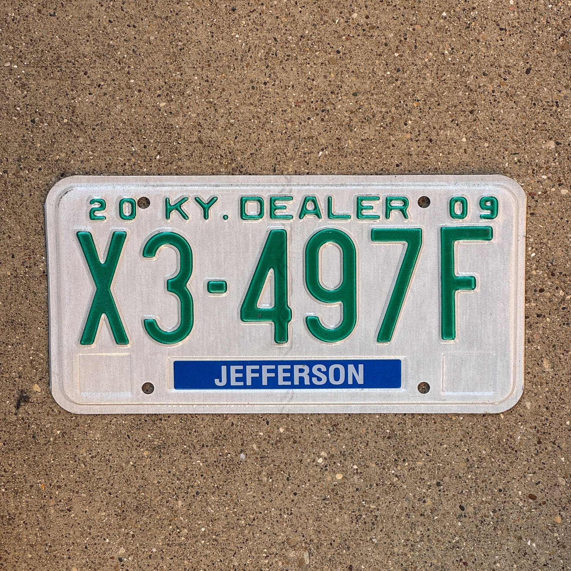 Photo of a 2009 Kentucky Dealer License Plate Auto Tag Garage Decor Vintage Jefferson County X3 497F