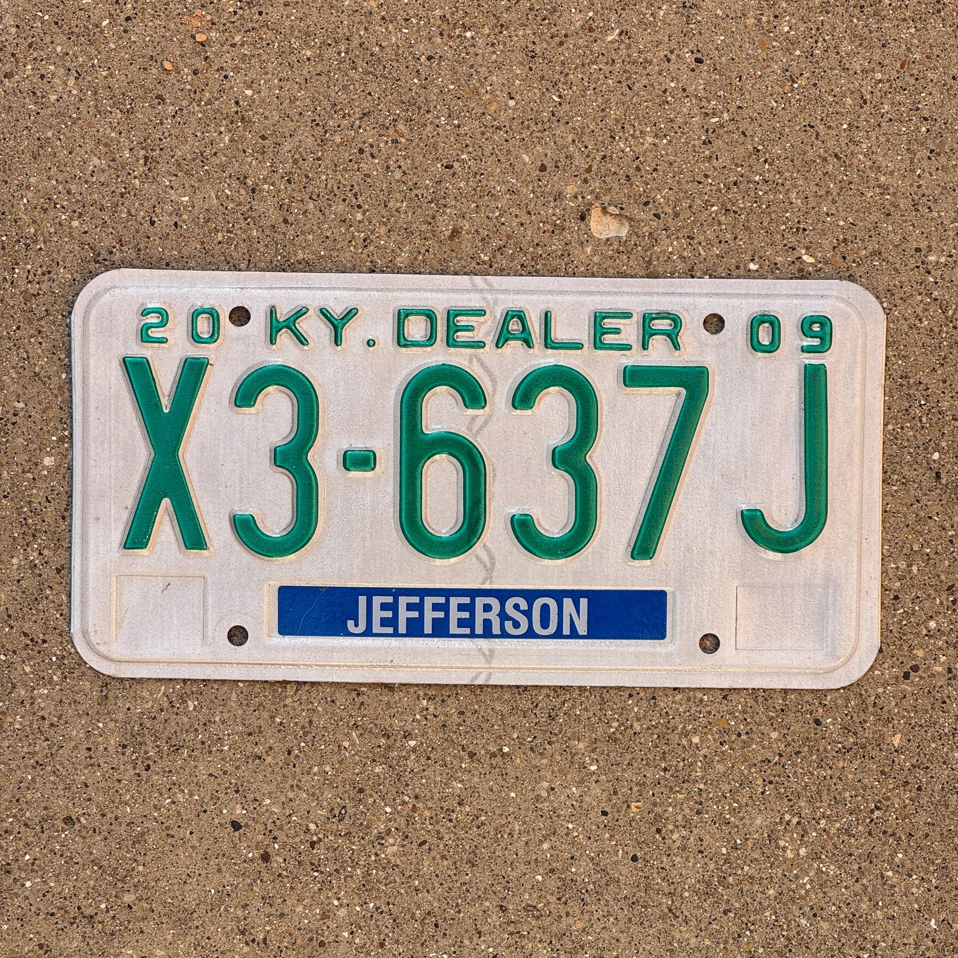 Photo of a 2009 Kentucky Dealer License Plate Auto Tag Garage Decor Vintage Jefferson County X3 637J